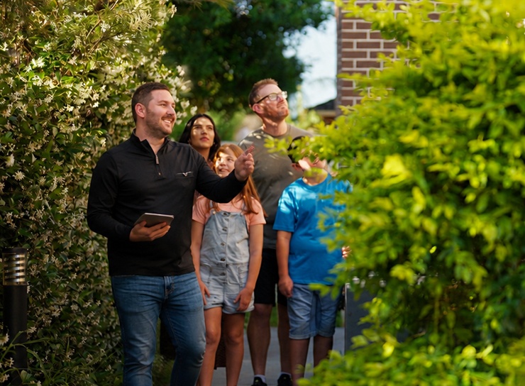 Realtor showing house to family