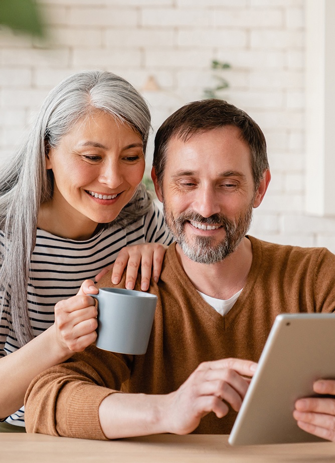 Homebuyers looking at tablet screen